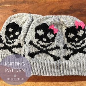 May include: Gray knitted skull beanie hats with black skull and crossbones design. One hat has a pink bow. The image also includes the text "KNITTING PATTERN" and "RELO_DESIGNS".