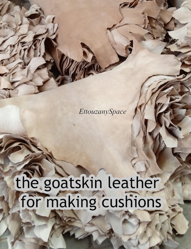 May include: A pile of beige goatskin leather pieces, with irregular edges, ready for crafting cushions. The image includes the text "EttouzanySpace" and "the goatskin leather for making cushions".