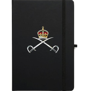 May include: A black notebook with a gold crown and crossed swords design. The notebook has a black elastic band closure.