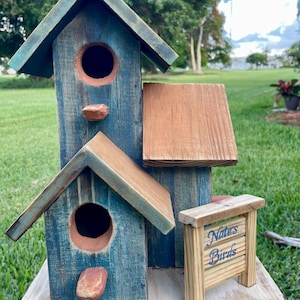 Handmade Wooden Birdhouse with Branch: Rustic Garden Decor.