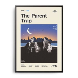 May include: Framed movie poster for "The Parent Trap" in a black frame. The poster shows a night scene with a crescent moon, stars, and a city skyline. The title is in large, bold letters, and the year 1998 is displayed.