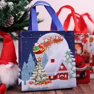 Améliorez votre expérience cadeau avec des sacs-cadeaux de Noël exquis, un sac-cadeau en plastique, un sac de transport, des sacs de fête de Noël