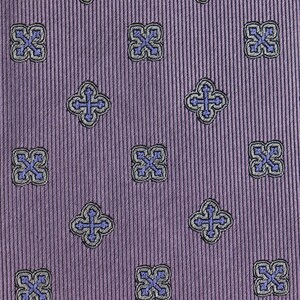 May include: Purple fabric with a repeating pattern of small, blue and gray crosses in a square shape.