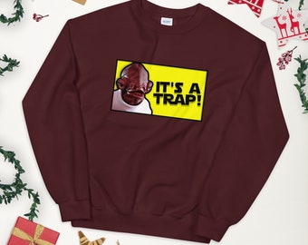 May include: A maroon sweatshirt with a yellow box featuring a character from the movie Star Wars. The text inside the box reads "It's a Trap!"