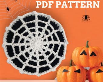 May include: A crochet spiderweb pattern with black and white yarn. The pattern is on an orange background with three orange pumpkins and black spiders. The text "PDF PATTERN" is at the top of the image.