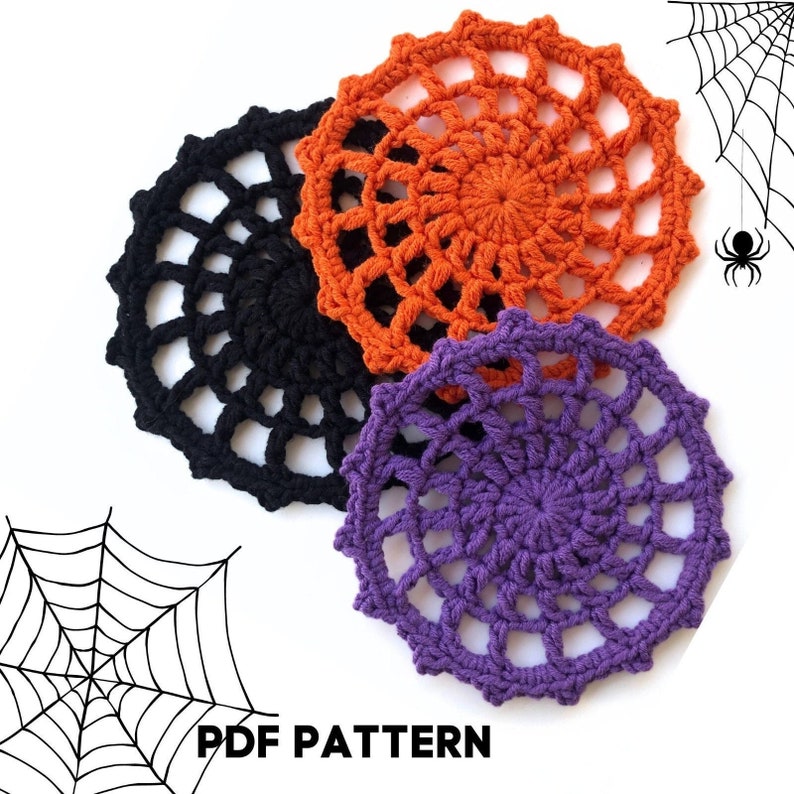 May include: Three crocheted spiderweb doilies in black, orange, and purple.  The doilies are arranged in a circle with the black doily at the bottom, the orange doily in the middle, and the purple doily at the top.  The image includes the text "PDF PATTERN".