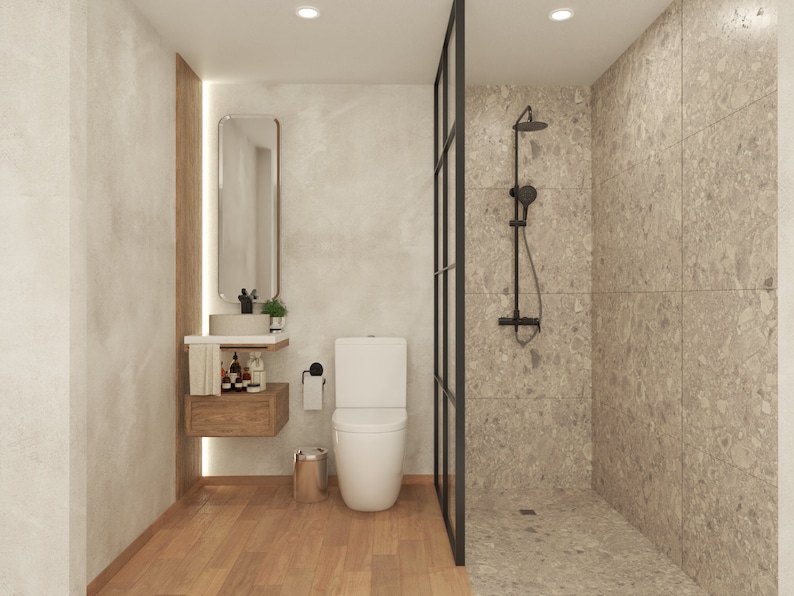 May include: A modern bathroom with a white toilet, a sink with a wooden vanity, and a glass shower stall with a black shower head.