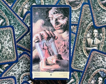 May include: Tarot card depicting the Eight of Swords, featuring a man with three eyes holding a glass jar with a woman inside. The card is surrounded by other tarot cards.