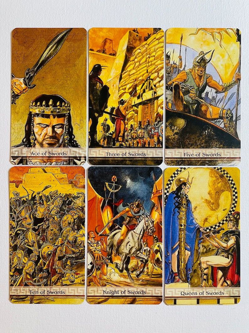 May include: A set of ten tarot cards depicting swords, with illustrations of warriors and battles. The cards are in a yellow and gold color scheme with a black and white border.