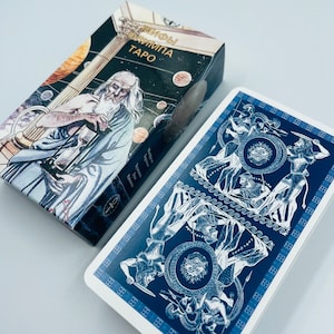 May include: A blue and white tarot card with a depiction of a battle scene. The card is from the "Myths of Olympus Tarot" deck.