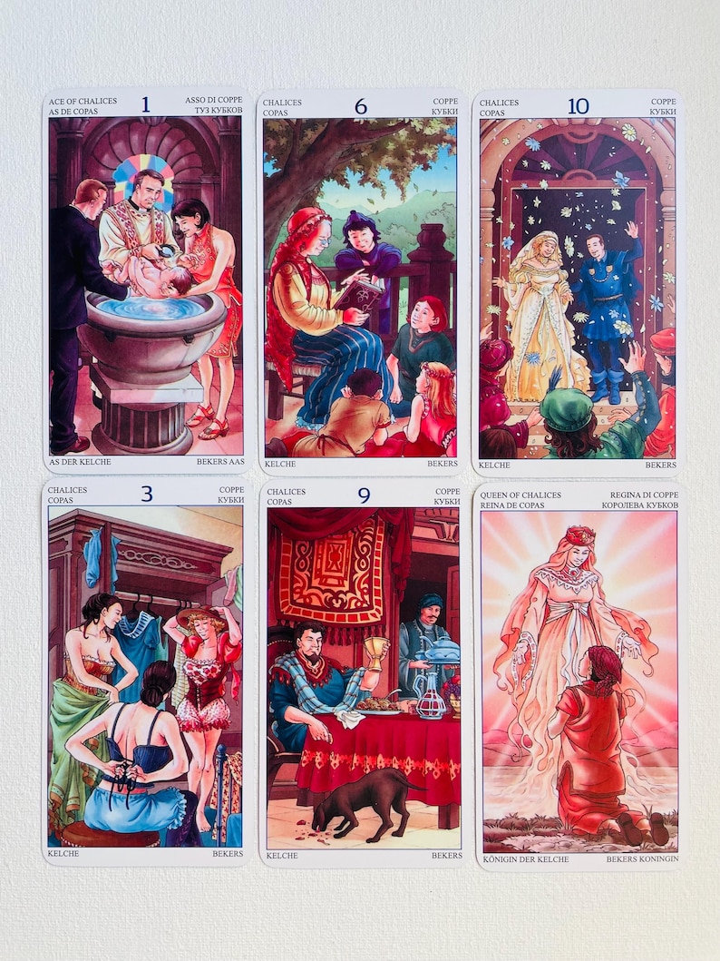 May include: Tarot card deck featuring ten cards from the Cups suit. The cards are illustrated with colorful scenes depicting various stages of life, from a baptism to a wedding. The cards are numbered 1 through 10 and include the Ace, Queen, and King of Cups.