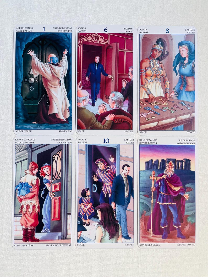 May include: Tarot card deck featuring the suit of wands. The cards are illustrated with colorful images of people and scenes. The cards are numbered 1 through 10, and include the Ace, Knave, and King of Wands.