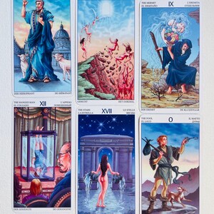 May include: A set of 22 tarot cards with colorful illustrations and text in multiple languages. The cards are arranged in a grid of 5 columns and 4 rows. The cards feature a variety of characters and scenes, including a man in a blue robe, a woman with a crown, a man hanging from a tree, and a woman standing in a doorway.
