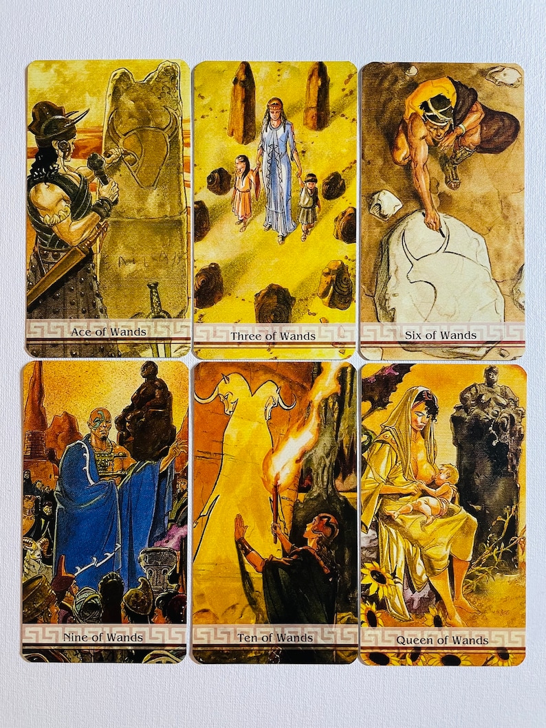 May include: A set of ten tarot cards featuring illustrations of people and scenes from the suit of Wands. The cards are in a yellow and brown color scheme with gold accents. The cards are arranged in two rows of five cards. The cards are labeled with the names of the cards: Ace of Wands, Three of Wands, Six of Wands, Nine of Wands, Ten of Wands, Queen of Wands.