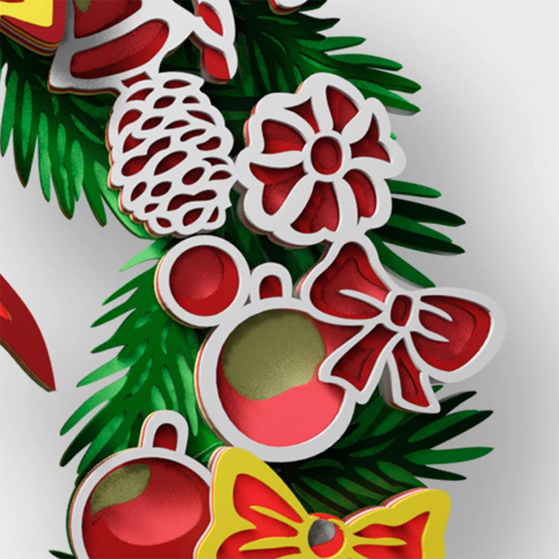 May include: A layered Christmas wreath decoration featuring green pine needles, a white pinecone, a red flower, a red bow, and red circular ornaments with gold accents. The design uses stacked cutouts to create depth with vibrant red, green, and yellow.
