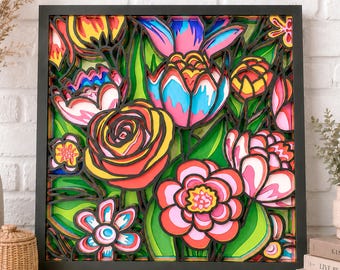 May include: A square, multi-layered wall art piece featuring a vibrant floral arrangement. The design includes stylized roses, tulips, and smaller blossoms in shades of pink, yellow, blue, and orange, set against a bright green background within a black frame.