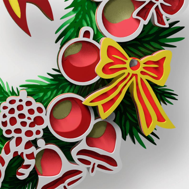May include: A decorative wreath featuring layered cutouts of green pine needles, red and white ornaments, red bells, and a prominent yellow and red bow. The design incorporates stylized holiday elements with a multi-dimensional appearance.