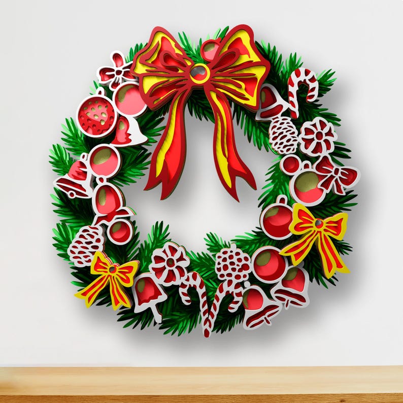 May include: A layered wooden Christmas wreath featuring green pine needles, red and yellow bows, red ornaments, white bells, candy canes, and pinecones. The design uses stacked cutouts to create a dimensional effect with vibrant holiday colors.