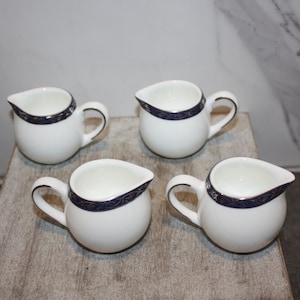 Set of Four Individual Creamers by Syracuse China
