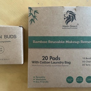K&ouml;nnte beinhalten: Zwei Schachteln mit umweltfreundlichen Produkten. Die kleinere Schachtel ist braun und tr&auml;gt die Aufschrift "Cotton Buds 100% Biologisch abbaubar 100 Stick ECO-FRIENDLY". Die gr&ouml;&szlig;ere Schachtel ist braun und tr&auml;gt die Aufschrift "Hash Direct Quality products everyday Bamboo Reusable Makeup Remover Pads 20 Pads With Cotton Laundry Bag Made From Eco-Friendly Sustainable Materials 10 Bamboo Pads 05 Charcoal Pads 05 Terry Cotton Pads Reusable Washable Eco-Friendly Chemical Free 8 cm Durchmesser 3 Schichten 100% Nat&uuml;rlich".