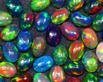 Lotto di cabochon di opale nero etiope AAA: opale naturale a fuoco multicolore di forma ovale, gemma ideale per la creazione di gioielli.