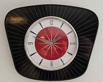 Vintage New Retro Atomic Age Style Clock. 1950s Styling in Red With Silver Rim and Hands Detail.
