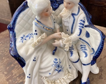 Dresden lace Victorian man & woman seated figurines.