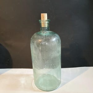 Antique aqua glass hand blown apothecary medicine bottle/jar.