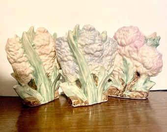 Vintage McCoy floral pottery in hyacinth chrysanthemum flower pastel vases pots planters from the 1940’s.