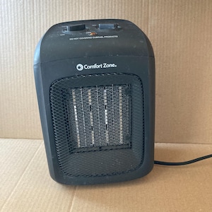 Vintage ceramic heater in black, desk top, bathroom, used twice, works good.