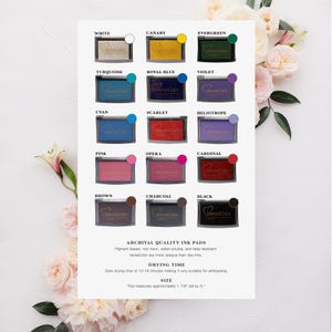 May include: A chart of 16 VersaColor ink pads in various colours, including white, canary, evergreen, turquoise, royal blue, violet, cyan, scarlet, heliotrope, pink, opera, cardinal, brown, charcoal, and black. The ink pads are archival quality, water-soluble, fade-resistant, and pigment-based. The drying time is 10-15 minutes, making them suitable for embossing. Each pad measures approximately 1 7/8 inches tall by 3 inches wide.