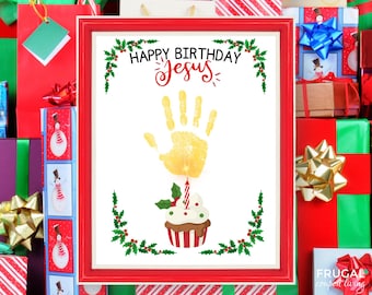 May include: A framed print with a red border, featuring the text "HAPPY BIRTHDAY Jesus" above a yellow handprint. Below the handprint is a cupcake with a lit candle and holly. The print is surrounded by Christmas-themed gift boxes.