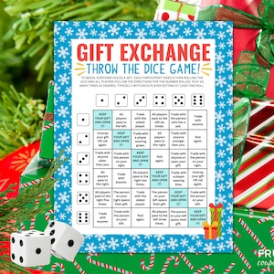 May include: A rectangular game card titled GIFT EXCHANGE THROW THE DICE GAME with a blue snowflake border. The grid contains instructions for dice rolls, including KEEP YOUR GIFT AND OPEN IT. Two white dice with black dots are in the foreground.