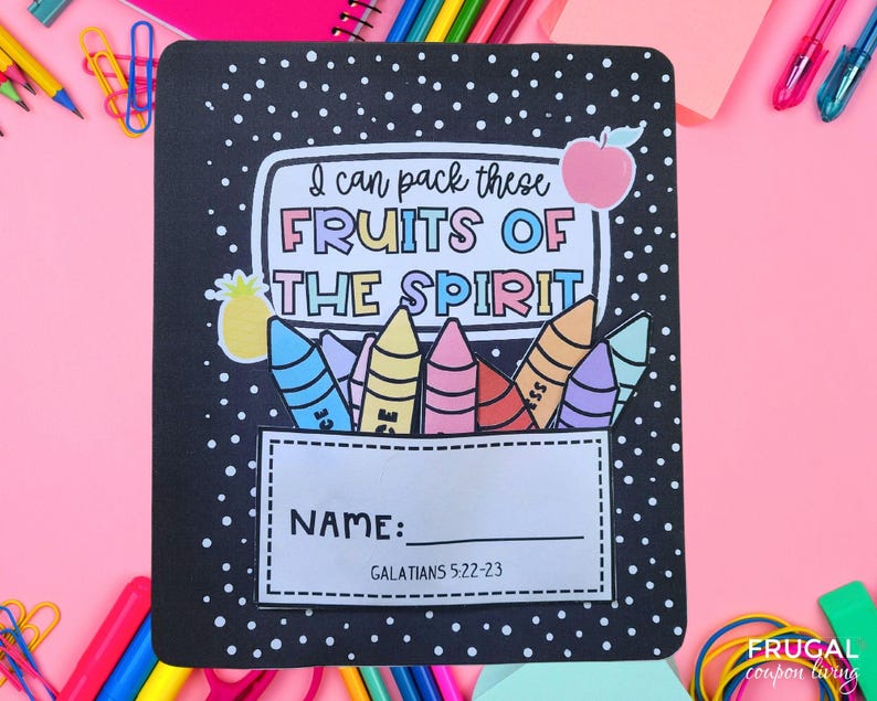 May include: Black notebook cover with white polka dots and the text "I can pack these FRUITS OF THE SPIRIT." Includes a space for the name and the Bible verse Galatians 5:22-23. Features colorful crayon and fruit illustrations.