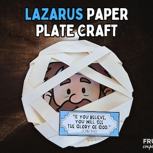 May include: A craft project featuring a paper plate decorated as Lazarus, with white paper strips wrapped around a cartoon face. A blue sign displays the quote "If you believe, you will see the glory of God."