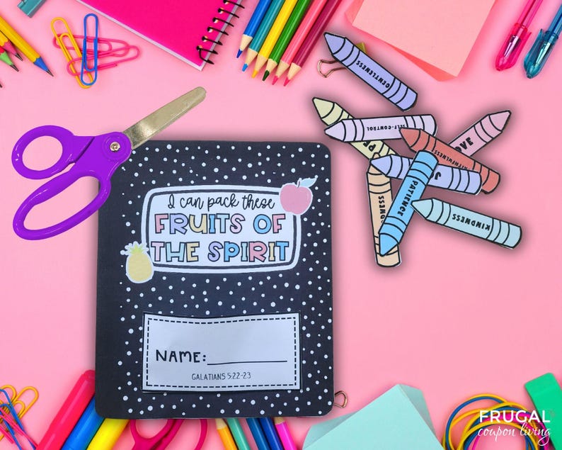 May include: A black notebook with white polka dots and the text "I can pack these FRUITS OF THE SPIRIT" is surrounded by school supplies. A pair of purple scissors, colourful crayons, and pencils are scattered on a pink background.