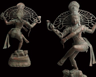 May include: A bronze statue of the Hindu deity Shiva in the Nataraja pose, a traditional dance pose. The statue is intricately detailed, with Shiva's hair flowing in the wind and his hands in a mudra, or symbolic gesture. The statue is standing on a base with a small figure of a demon.