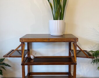 Unique Vintage Wooden Side Table with Fold Out Shelves. PLEASE NOTE delivery quoted is for metro Melbourne. Free pick up avail.