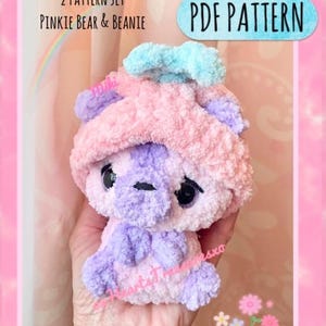 May include: A crochet pattern set for a pink and purple bear and a matching beanie. The pattern is called "Low Sew PDF Pattern" and is available for download. The pattern set is called "2 Pattern Set Pinkie Bear & Beanie".