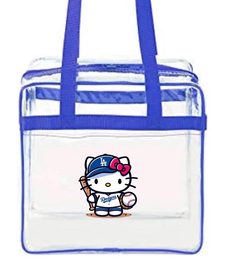 May include: Transparent tote bag with blue edging and handles. It features a cartoon Hello Kitty in a Dodgers baseball uniform, holding a bat and ball. The bag has a zip closure and is designed for carrying items.