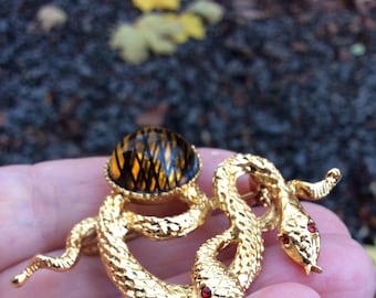 Vintage Gold Tone Snake Brooch: Knotted Serpent Pin with Amber Orb