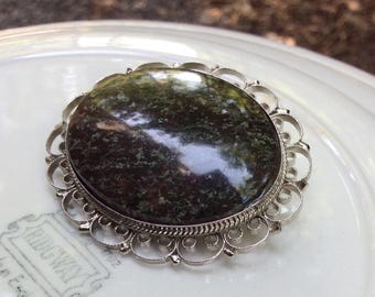Vintage Ornate Filigree oval Brooch: Silver Tone, Blue Speckled Cabochon