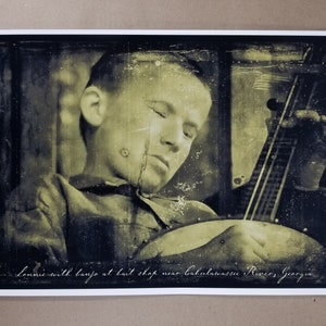 Deliverance Movie Poster 12&quot; x 18&quot; - Lonnie Banjo Black White - Caption reads -Lonnie with banjo at bait shop near Calahassee River, Georgia