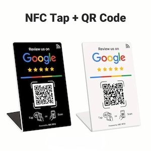 Peut inclure: Deux présentoirs NFC tap et code QR, un noir et un blanc, avec le logo Google et cinq étoiles dorées. Les présentoirs ont un code QR et les mots "Tap" et "Scan". Le texte "NFC Tap + QR Code" est en haut.