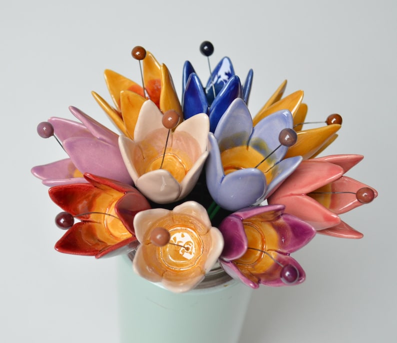 Colourfull, hand-made, lovely ceramic flowers: tulip, avaiable in 8 colours. 
They are fixed on a green wire (l=20cm), you can put them in a vase, next to your inside plant or outside.