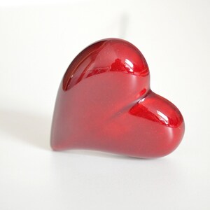 Handcrafted ceramic heart.

You can add to ceramic flower bouquet.