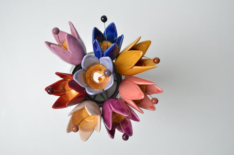 Colourfull, hand-made, lovely ceramic flowers: tulip, avaiable in 8 colours. 
They are fixed on a green wire (l=20cm), you can put them in a vase, next to your inside plant or outside.