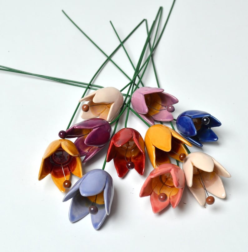 Colourfull, hand-made, lovely ceramic flowers: tulip, avaiable in 8 colours. 
They are fixed on a green wire (l=20cm), you can put them in a vase, next to your inside plant or outside.