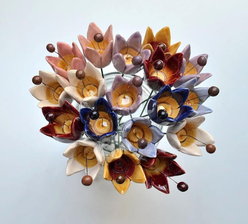 Colourfull, hand-made, lovely ceramic flowers: tulip, avaiable in 8 colours. 
They are fixed on a green wire (l=20cm), you can put them in a vase, next to your inside plant or outside.