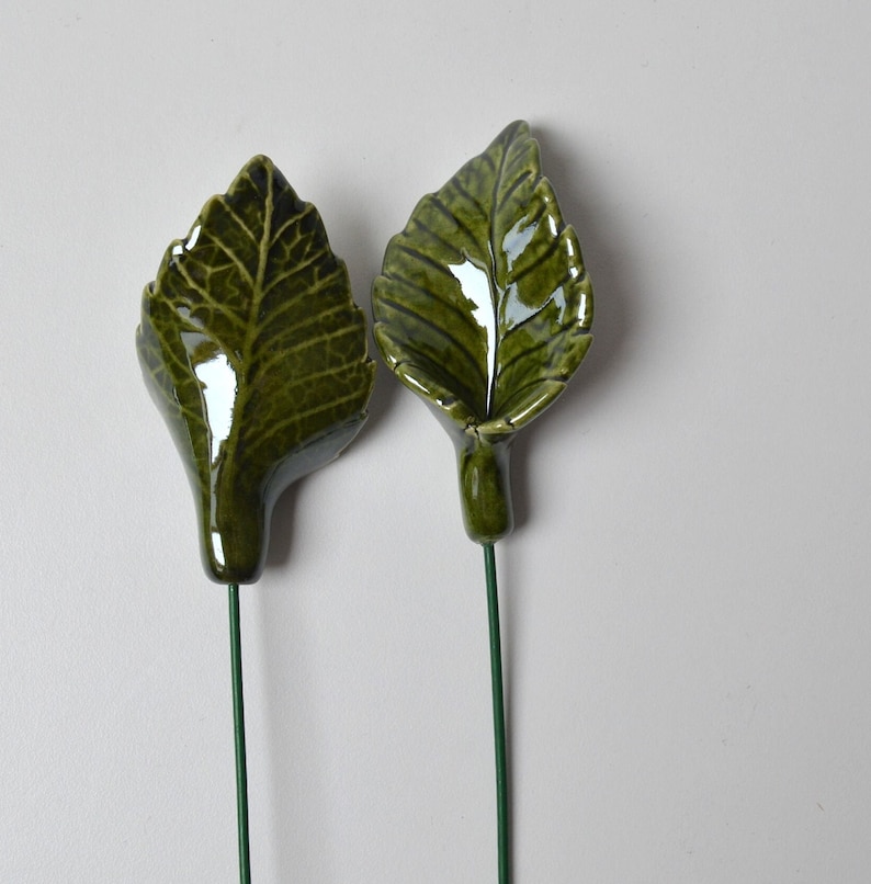 Handcrafted ceramic rose leaf.

You can add to ceramic flower bouquet.